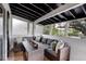 Relaxing sunroom with comfortable seating and natural light, perfect for enjoying the outdoors from inside at 4705 Hollingsworth Ave, Sarasota, FL 34233