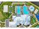 Overhead view showcasing a clubhouse with pool, spa, play area, beach volleyball, and putting green at 5129 Marina Basin Ct, Bradenton, FL 34211