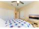 Bright bedroom featuring a double door closet and a ceiling fan for comfort at 5129 Marina Basin Ct, Bradenton, FL 34211