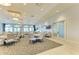 Spacious dining room with tables, chairs, and large windows, perfect for community gatherings and events at 5129 Marina Basin Ct, Bradenton, FL 34211