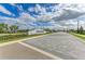 Inviting community entrance sign with lush landscaping and paver road at 5129 Marina Basin Ct, Bradenton, FL 34211