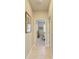 Hallway with tiled flooring, and a bedroom conveniently located nearby at 5129 Marina Basin Ct, Bradenton, FL 34211