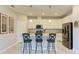 Kitchen showcasing an island with seating, sleek appliances, and ample cabinet space at 5129 Marina Basin Ct, Bradenton, FL 34211