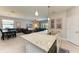 Kitchen with granite countertops and sink overlooking dining and living areas at 5129 Marina Basin Ct, Bradenton, FL 34211