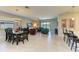 Open-concept living room with dining area, tile floors and lots of natural light at 5129 Marina Basin Ct, Bradenton, FL 34211