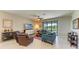 Open-concept living area showcasing a sliding glass door and views of the lanai at 5129 Marina Basin Ct, Bradenton, FL 34211