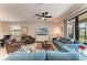 Living room featuring two sofas, a ceiling fan, and access to the outdoor space at 5129 Marina Basin Ct, Bradenton, FL 34211