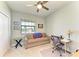 Bright home office with a ceiling fan, a large window, and comfortable seating at 5129 Marina Basin Ct, Bradenton, FL 34211