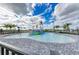 Community splash pad featuring various colorful water features, set against a backdrop of palm trees and blue sky at 5129 Marina Basin Ct, Bradenton, FL 34211
