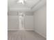 Bright hallway leading to bedrooms, illuminated by recessed lighting and a ceiling fan at 5354 Nathaniel Pl, Sarasota, FL 34233