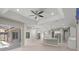 Spacious living area flowing into the kitchen featuring modern finishes, recessed lighting, and large windows at 5354 Nathaniel Pl, Sarasota, FL 34233