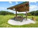 A shaded picnic area with a table offers residents a delightful space to enjoy outdoor meals and gatherings at 5354 Nathaniel Pl, Sarasota, FL 34233