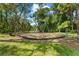 A vibrant playground surrounded by lush greenery, offering a fun and safe area for children to play at 5354 Nathaniel Pl, Sarasota, FL 34233