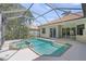 Screened-in pool area featuring a sparkling pool and jacuzzi, perfect for outdoor relaxation and entertainment at 5354 Nathaniel Pl, Sarasota, FL 34233