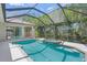 This covered backyard pool includes a connected jacuzzi, providing a relaxing and private outdoor retreat at 5354 Nathaniel Pl, Sarasota, FL 34233