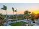 Beautiful ocean view from the backyard with white picket fence and tall palm trees at 540 Beach Rd # 510, Sarasota, FL 34242