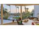 Breathtaking view from the covered patio, overlooking the beach and tropical foliage at 540 Beach Rd # 510, Sarasota, FL 34242