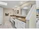 Bright bathroom with double sinks, granite counters, and ample storage, perfect for a Primary suite at 540 Beach Rd # 510, Sarasota, FL 34242
