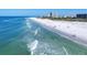 Beautiful ocean waves gently lap against a wide, white sand beach, near beachfront properties at 540 Beach Rd # 510, Sarasota, FL 34242