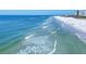 Calm blue ocean meeting a pristine white sand beach creates a picturesque and inviting scene at 540 Beach Rd # 510, Sarasota, FL 34242