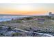 Picturesque beach view featuring a sandy shoreline, tranquil ocean, and a stunning sunset skyline at 540 Beach Rd # 510, Sarasota, FL 34242