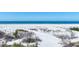 Scenic view of white sand dunes and a serene beach with turquoise water and a few people at 540 Beach Rd # 510, Sarasota, FL 34242
