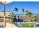 Stunning beach view from the property's balcony, featuring palm trees and blue ocean waters at 540 Beach Rd # 510, Sarasota, FL 34242