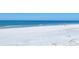 Panoramic view of a pristine white sandy beach and clear blue ocean with a few people relaxing at 540 Beach Rd # 510, Sarasota, FL 34242