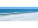 Expansive beach with white sand and tranquil blue waters invite relaxation and coastal living at 540 Beach Rd # 510, Sarasota, FL 34242
