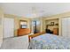 Bedroom features a ceiling fan, sliding glass door with a patio, and an office nook area at 540 Beach Rd # 510, Sarasota, FL 34242