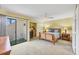 Bedroom boasts a ceiling fan, sliding glass door with a patio and an office nook area at 540 Beach Rd # 510, Sarasota, FL 34242