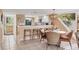 Cozy dining area with bar seating, stylish wicker furniture, and lovely light fixture at 540 Beach Rd # 510, Sarasota, FL 34242