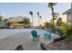 Beautiful beach house exterior with two blue Adirondack chairs on a paved area among lush greenery at 540 Beach Rd # 510, Sarasota, FL 34242