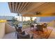 Inviting outdoor patio with dining set, perfect for enjoying the coastal breeze at 540 Beach Rd # 510, Sarasota, FL 34242