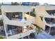 Multi-level home featuring outdoor dining, balconies, and a bedroom view, perfect for coastal living at 540 Beach Rd # 510, Sarasota, FL 34242