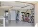 Well-organized garage with epoxy flooring provides ample storage space for bikes, beach gear and more at 540 Beach Rd # 510, Sarasota, FL 34242