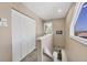 Bright hallway with closet space, a staircase, and a window offering beautiful beach views at 540 Beach Rd # 510, Sarasota, FL 34242