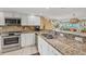 Well-appointed kitchen showcasing stainless steel appliances and beautiful granite countertops at 540 Beach Rd # 510, Sarasota, FL 34242