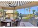 Covered lanai with dining set, ceiling fan and view of the beach and ocean at 540 Beach Rd # 510, Sarasota, FL 34242