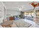 Living room with tiled floors, a spiral staircase, and sliding glass doors to the outdoor patio at 540 Beach Rd # 510, Sarasota, FL 34242