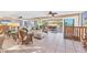 Spacious living room with tile floors and sliding glass doors to a covered patio at 540 Beach Rd # 510, Sarasota, FL 34242