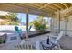 Relaxing patio area with Adirondack chairs, spiral staircase, and tropical plants offers a serene outdoor space at 540 Beach Rd # 510, Sarasota, FL 34242