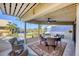Inviting covered patio featuring comfortable seating and serene views of the lush landscape and ocean at 540 Beach Rd # 510, Sarasota, FL 34242