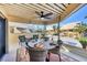 Charming covered patio featuring comfortable seating, a ceiling fan, and a serene outdoor dining area at 540 Beach Rd # 510, Sarasota, FL 34242