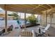 Outdoor patio with palm trees, seating, and a spiral staircase at 540 Beach Rd # 510, Sarasota, FL 34242