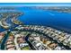 Incredible aerial view showcasing beautiful waterfront homes on canals, with a bay in the background at 541 Fore Dr, Bradenton, FL 34208