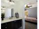 Bathroom view from bedroom with undermount sink, custom cabinets, and modern lighting at 541 Fore Dr, Bradenton, FL 34208