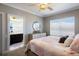 Comfortable bedroom with ensuite bathroom, carpet, and natural light from a window at 541 Fore Dr, Bradenton, FL 34208