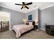 Comfortable bedroom featuring carpet, a ceiling fan, and modern decor at 541 Fore Dr, Bradenton, FL 34208