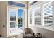 Bedroom with door to the screened in lanai featuring a pool at 541 Fore Dr, Bradenton, FL 34208